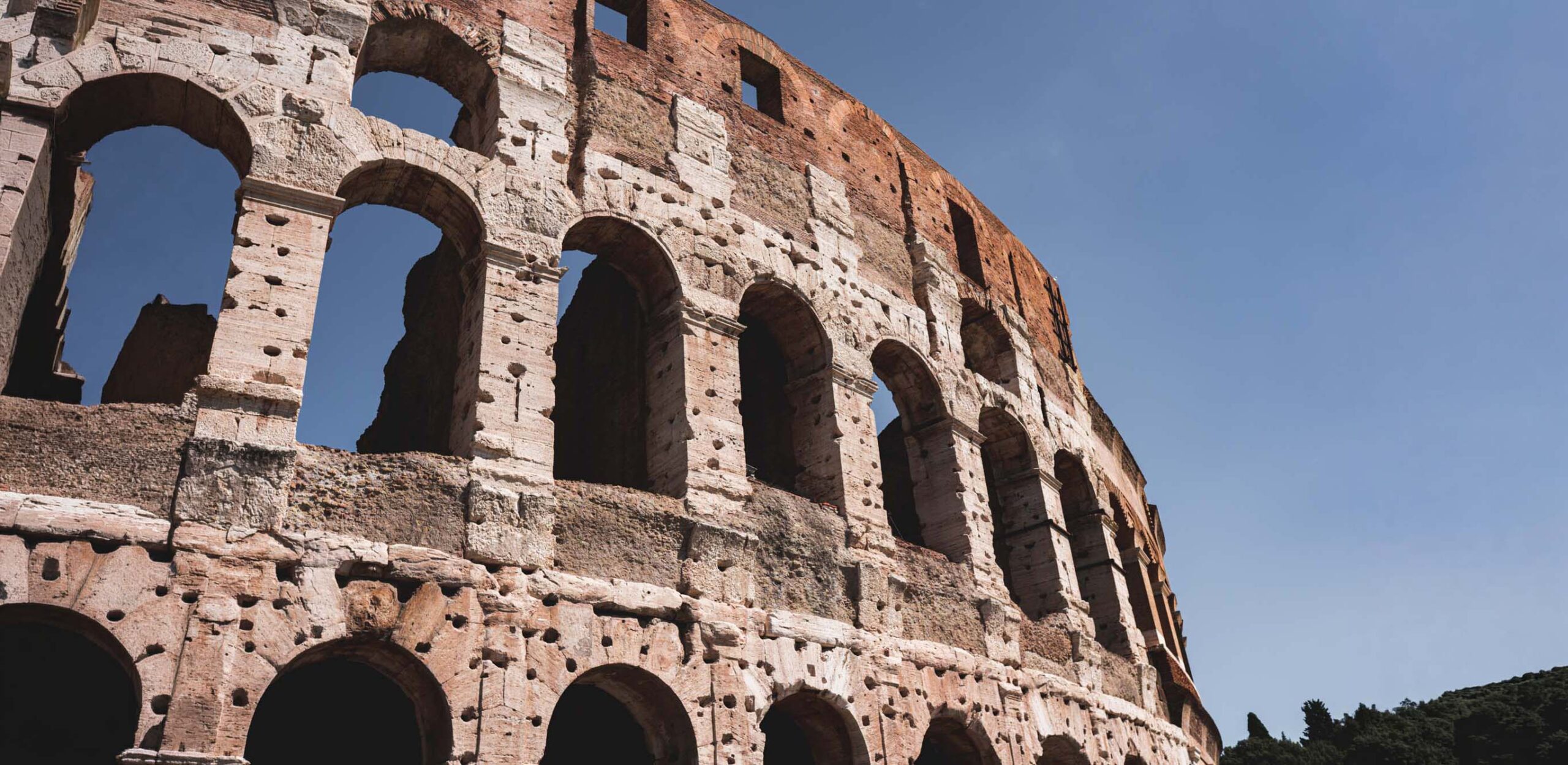 The Colosseum and the Imperial Forums in Rome beautiful shot aro